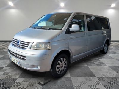 a picture of a silver van parked on a checkered floor
