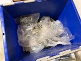 a blue box with a bunch of plastic items in it
