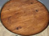 a wooden table with a metal tray on top of it