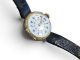 a watch that is sitting on a black leather strap
