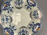 two plates and a bowl are sitting on a table
