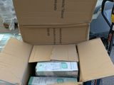 a stack of boxes sitting on the floor next to a carton