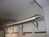 a shelf that has some signs on it in a room