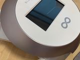 a small device that is sitting on the floor next to a cell phone