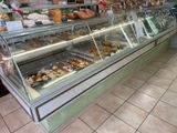 a display case with many different types of pastries in it