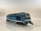 a toy train that is sitting on a white surface