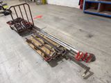 an image of a dolly truck with wood on it in a warehouse