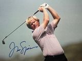 signed photo of a man swinging a golf club on a cloudy day