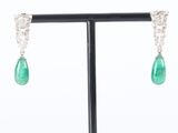 a pair of emerald and diamond earrings