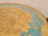 a table that has a blue and yellow design on it