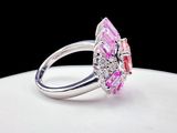 an image of a pink and white diamond ring on a white plate