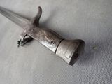 a small metal object that is laying on a table