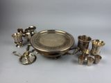 an assortment of silverware including cups, spoons and cups
