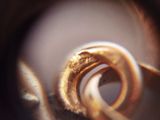 a close up of a piece of metal with a ring on it