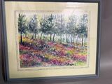 aquarelle encadrée représentant un champ de fleurs sauvages avec des arbres en arrière-plan