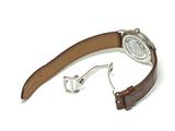 brown leather watch strap with a silver buckle on a white background