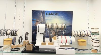 a display of various watches and bracelets in a store