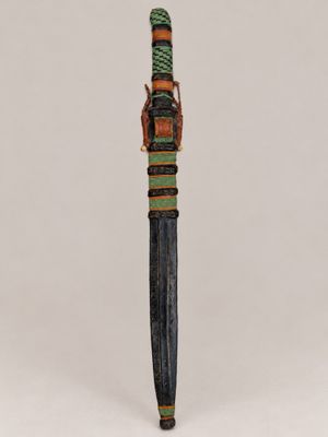 a small knife with a wooden handle on a white surface