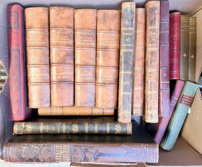 a box full of old books sitting on a table
