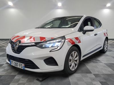 a white car with red and white stripes parked in a garage