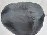 a black paper mache hat on a white background