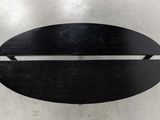an image of a black object on a metal surface