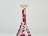 a glass vase that has a flower design on it