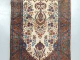 an antique persian rug with a floral design on a white background