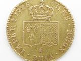 an old gold coin with a crown on top of it