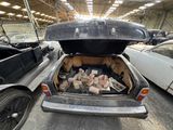 a trunk of a car with a bunch of bricks in it