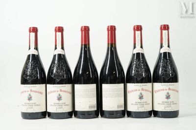 six bottles of wine are lined up in a row on a white surface