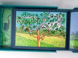 a painting of a tree in a box on a table