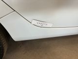 a close up of a car door with a sticker on it