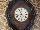 a clock that is hanging on the wall in the room