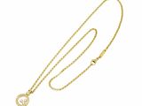 a gold necklace with a crescent pendant and a chain