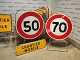 many signs that are sitting on the floor near each other