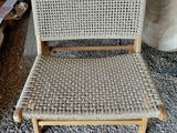an image of a chair made out of wood and wicker
