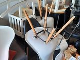 a lot of chairs and a table in a room