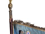 a blue flag with a gold star on top of it