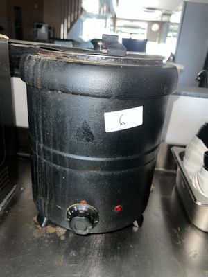 an image of a black pot sitting on a table