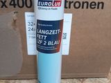 a box that has a bottle of blue paint on it