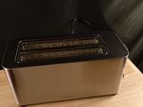 a toaster that is sitting on a wooden table