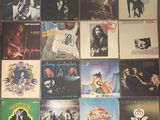 a lot of records on the floor of this room