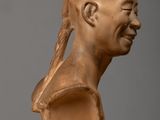 an image of a clay sculpture of a man ' s head on a table