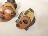 three masks that are sitting on a table