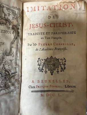 an old book that is open on a table