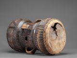 a close up of a wooden vase with a handle