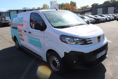 a white van that is parked in a parking lot