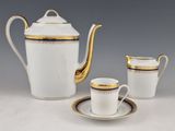 three pieces of porcelain tea and coffee set with gold trimming