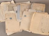 a lot of old papers that are on a table